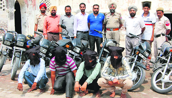 The four thieves arrested by the CIA branch of Bathinda police, along with the stolen motorcycles. A Tribune Photo