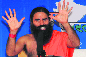 Yoga guru Ramdev addresses mediapersons at Garhwal Bhawan in Sector 29, Chandigarh, on Tuesday.