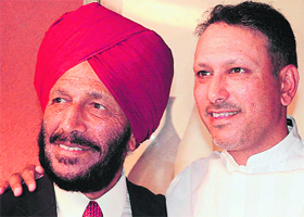 Jeev Milkha Singh (right) with his father Milkha Singh at Chandigarh Golf Range on Tuesday.