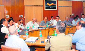 Chief Secretary Subhash Kumar holds a meeting with officials of the National Human Rights Commission in Dehradun on Tuesday. 