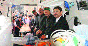 Chief Minister Virbhadra Singh sits inside an ambulance at the launch of 50 new ambulances in Shimla on Tuesday.