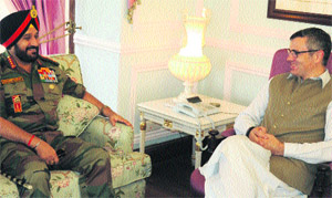 Army Chief General Bikram Singh and Chief Minister Omar Abdullah discuss state security in Srinagar on Tuesday. 