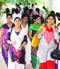 Students on their first day at the Government College for Women, Gandhi Nagar, Jammu, on Tuesday. 