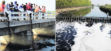 Officials release microbes into Budha Nullah near Jainpur village on December 4, 2012, and (right) the segregation point for taking out the solid waste manually from the nullah. 