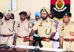 Commissioner of Police PS Gill shows weapons seized from the accused in Doraha on Tuesday. 
