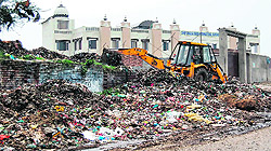 Vehicles seen dumping garbage at the land on Chabaal road in Amritsar
