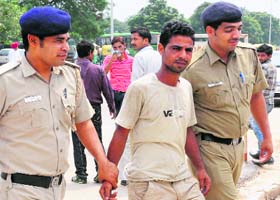 The accused, Parkash, being taken to the District Courts in Sector 43, Chandigarh, on Wednesday