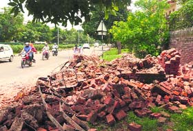 The bus stop shed that collapsed on the road separating Sectors 9 and 16 in Panchkula on Wednesday