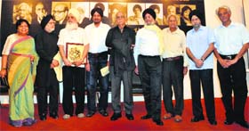 Artists pose for a photograph after the award ceremony conducted by the Chandigarh Lalit Kala Akademi at the Government Art Gallery and Museum, Sector 10, in Chandigarh on Wednesday
