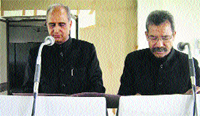 HPSSSB Chairman JK Chauhan administers the oath of office and secrecy to newly appointed member of the board SR Mehta in Hamirpur on Wednesday.