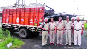 Policemen with seized truck which was robbed on Monday night in Jalandhar.