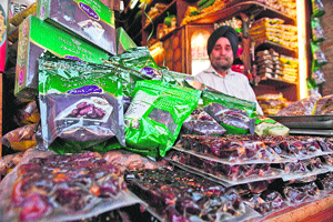 A shopkeeper sells dates in Srinagar. 