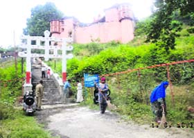 Sweepers clean the premises of Hariparbat temple as a part of the sanitation drive in Srinagar on Wednesday