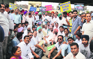 Congress activists protest in Ludhiana on Wednesday. 