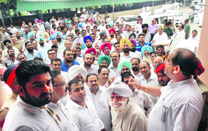 Councillors and activists of Congress party hold a dharna against slow pace of development works in Ludhiana on Wednesday. 