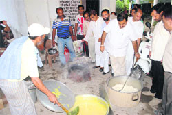 Punjab BJP general secretary Tarun Chugh inspects the quality of food served under the Mid-Day Meal Scheme at a government school in Amritsar on Thursday.