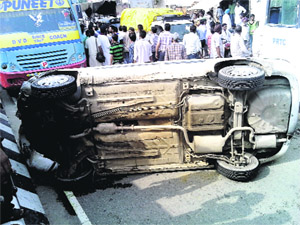 The ill-fated car that overturned following a collision with a private bus on the GT Road in Bathinda on Thursday.