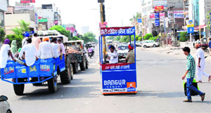 A traffic police constable at work from a kiosk to protect himself from the hot sun in Bathinda on Thursday. 