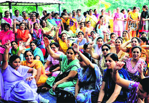 Government schoolteachers gather at the Masjid Ground, Sector 20, Chandigarh, to oppose the proposal of the UT Education Department to extend their working hours, on Thursday. 