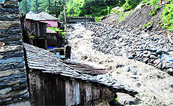 A swollen rivulet at Bagi village in Mandi on Wednesday night