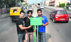 The three youths who have put up radium-plated reflectors at accident-prone sites for the convenience of night comuters in Jalandhar. photo: Sarabjit singh