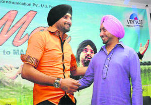  Harbhajan Singh and (right) Satinder Sartaj 