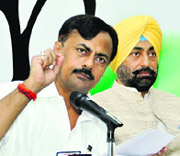 Prem Chand Mishra, AICC representative, at Congress Bhawan in Chandigarh on Thursday. Also seen is PPCC spokesman Sukhpal Singh Khaira. 