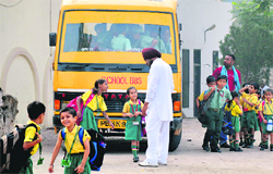 A school bus ferries children after operators called off the strike in Ludhiana on Friday. Photo: Inderjeet Verma