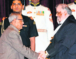 President Pranab Mukherjee greets new CJI Justice P Sathasivam in New Delhi on Friday