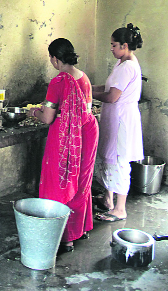 Mid-day meal being prepared at an unhygienic kitchen in Jalandhar on Friday.