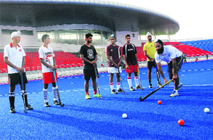 Former India captain Rajpal Singh trains players at the newly-constructed hockey stadium in Phase IX, Mohali, on Friday. 