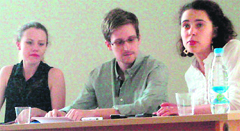 A file photo of Edward Snowden with rights activists at Moscows Sheremetyevo airport. 