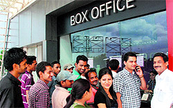 Residents queue up at a movie ticket counter in Shalimar Hall, Panchkula