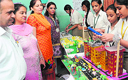 Students showcase an eco-city model during a science exhibition at Saupins School, Sector 32, in Chandigarh on Saturday