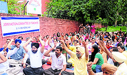 Members of the Joint Action Committee of Teachers protest in Chandigarh on Saturday