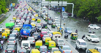 Waterlogging causes a traffic jam at ITO after a downpour in New Delhi on Saturday.