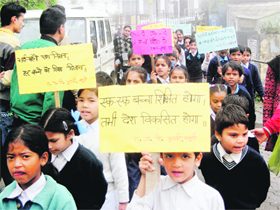 Students of government primary school stage a rally to create awareness of education in Mussoorie on Saturday.