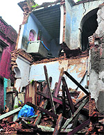 A house that collapsed following heavy rain at Kali Channi in Jain Bazaar in Jammu on Saturday