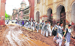 Mud and slush at the historic Mubarak Mandi complex following unplanned digging and renovation work that is causing hardships to residents, students and pedestrians in Jammu