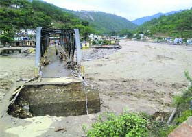 A washed away portion of a bridge near Sonprayag in Rudraprayag district