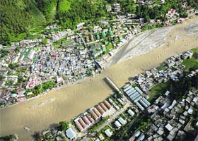 An aerial view of Uttarkashi, with a broken bridge after the floods