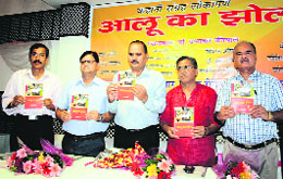 The Book "Alu Ka Jhool" written by Dr Prabhakar Uniyal being released at a function in Dehradun on Saturday.