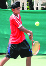 Dalbir Singh returns a shot during a match at the CLTA, Sector 10, in Chandigarh on Sunday.
