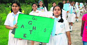 Students of Sacred Heart School, Sector 26, spread awareness on environment conservation at Rose Garden in Chandigarh on Sunday.