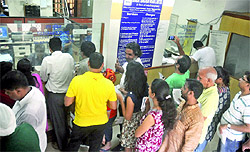 People queue up to send telegrams on the last day of the service at Telegraph Office, Eastern Court, Janpath in New Delhi