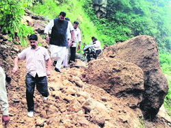 MLA, Mussoorie, Ganesh Joshi inspects a road damaged due to heavy rains in the Mal Devta region. 