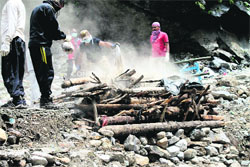 Uttarakhand Police officials cremate unclaimed bodies at Rambara.