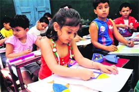 Children participate in a painting competition organised by Indian Art Centre at Shiksha Niketan School, Gandhi Nagar, in Jammu on Sunday