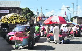 No Restrictions: People visit markets to make purchases after the curfew was lifted in Srinagar on Sunday