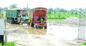 Unloaded gypsum lies in a muddy area